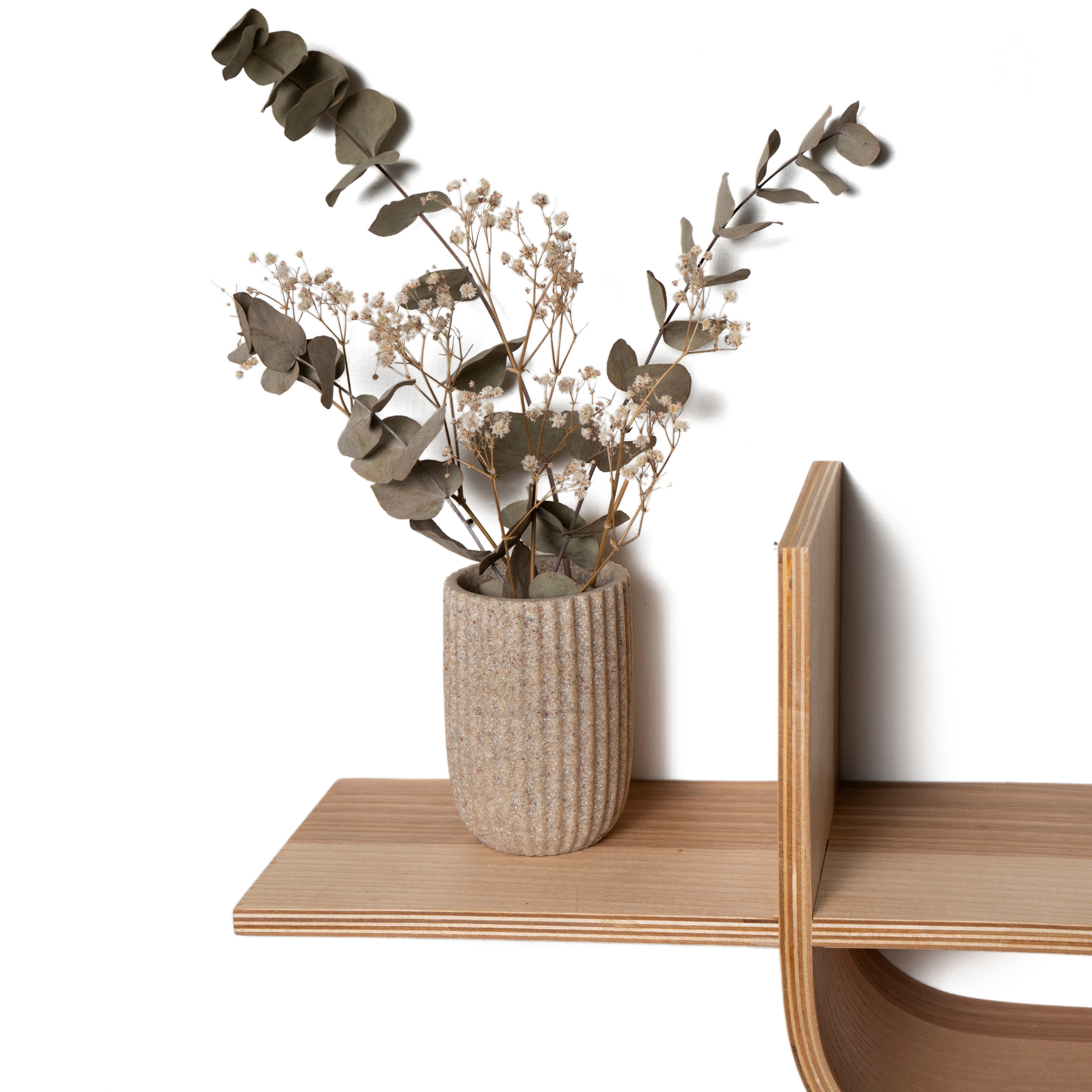 Wooden shelf with asymmetrical shape with open space for decor