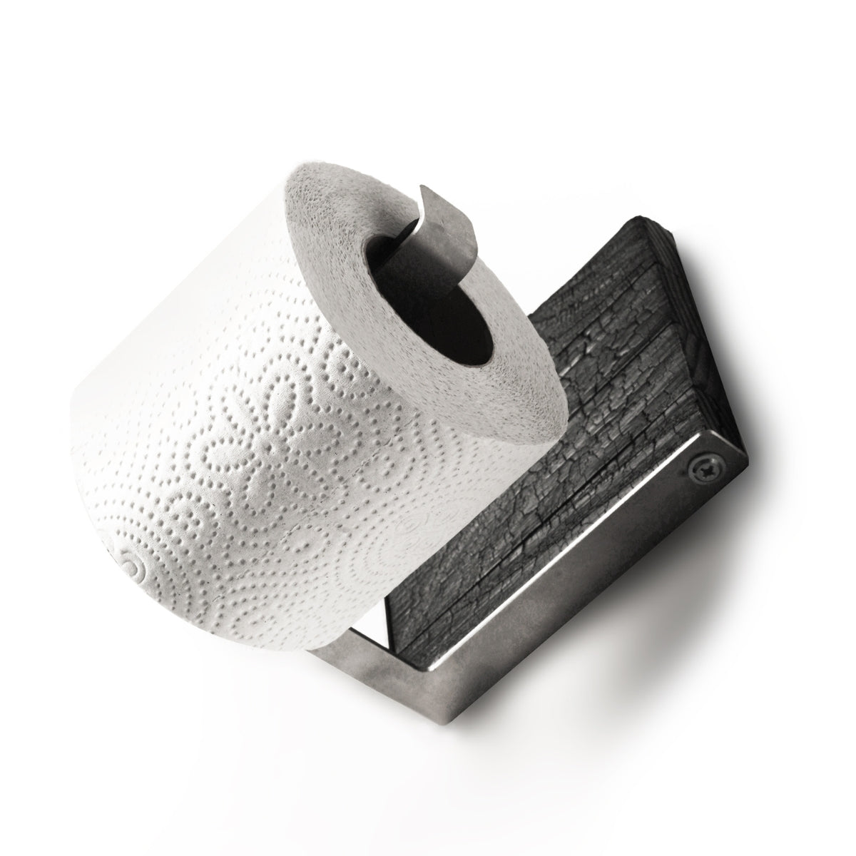 Close-up of a burned ash wood and stainless steel toilet paper holder with a single roll of toilet paper. The design features a sleek metal bar and textured wood