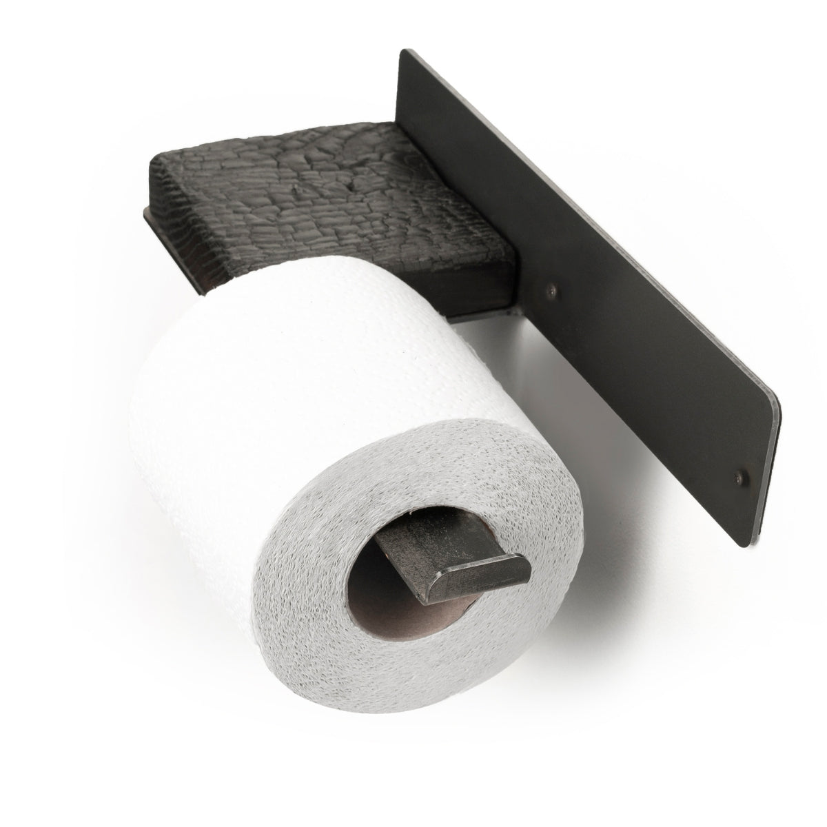 Close-up of a wall-mounted burned wood and metal toilet paper holder, holding a single roll of toilet paper, showcasing an industrial look.