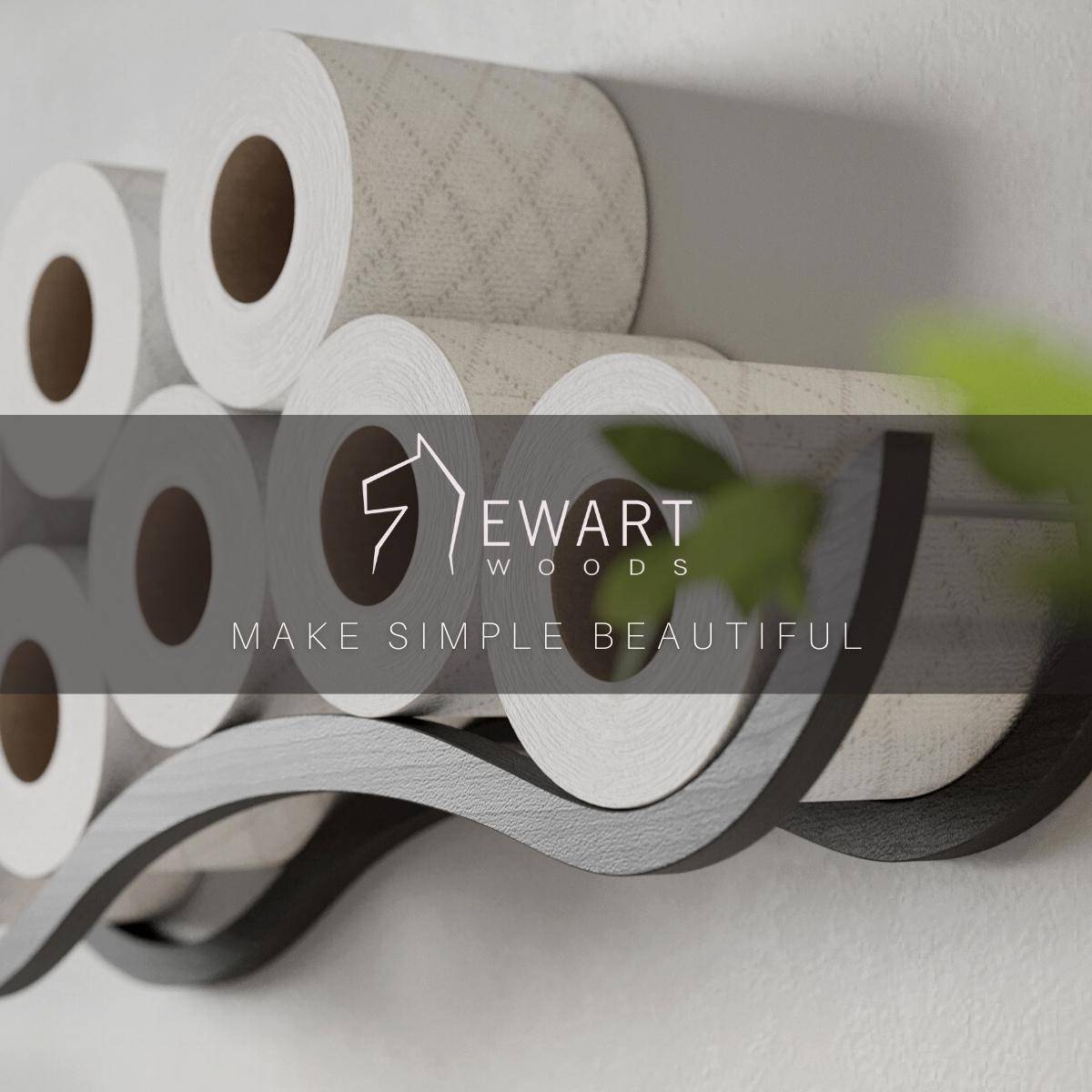 Close-up of a wall-mounted wave design wooden toilet paper holder, displaying several rolls. The EWART WOODS logo and the slogan MAKE SIMPLE BEAUTIFUL are overlaid on the image.