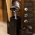 Black metal utensil holder with stainless steel ladles. Product details include Made in Europe, Available in two designs, and Made of high-quality steel.