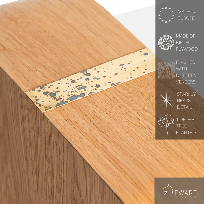 Close-up of modern wooden coffee table with brass accent on top and manufacturer specifics