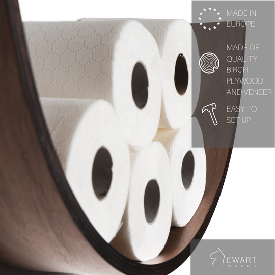 Close-up of a walnut wood curved toilet paper holder with a dark stained side, holding six rolls of toilet paper. The image includes text indicating that the product is made in Europe, crafted from quality plywood, and easy to set up. The EWART WOODS logo is visible.