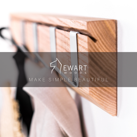 Wall mounted wood hanger with metal hooks by EWART WOODS