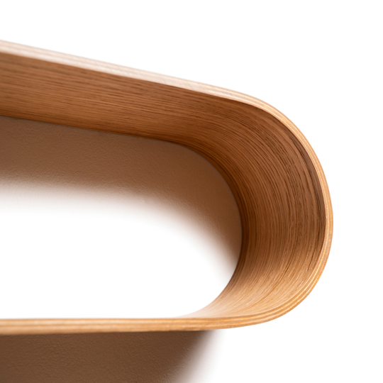Geometric floating shelf wall mounted wooden curved edge close-up