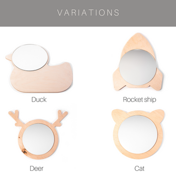 Four different wooden mirror designs: a duck, a rocket, a deer, and a cat. Each has a natural wood frame with a circular mirror centered within the shape, showcasing a polished and sleek finish.