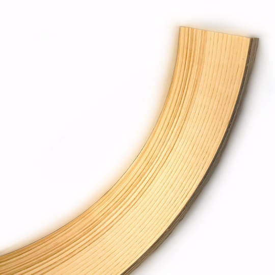 Close-up of a curved ash wood piece showcasing the smooth texture and layered construction of the wood, highlighting the craftsmanship and natural finish.