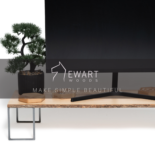 Wooden monitor stand with tree bark and metal legs produced by EWART WOODS