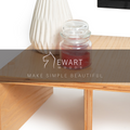 Wooden monitor stand with compartments featuring EWART WOODS branding