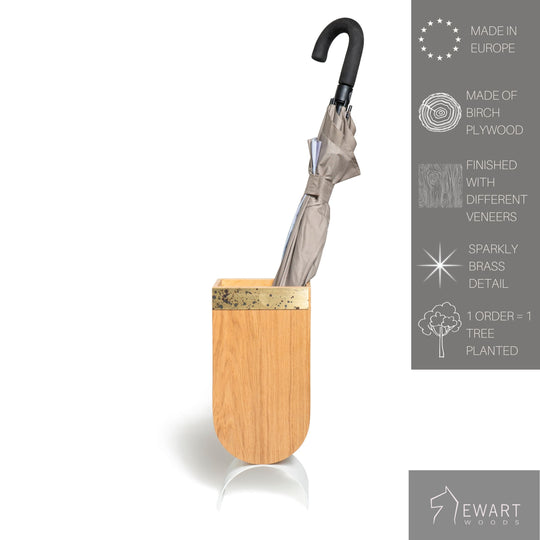Wooden standing umbrella holder with brass edge design and white curved metal leg along manufacturer specifics 