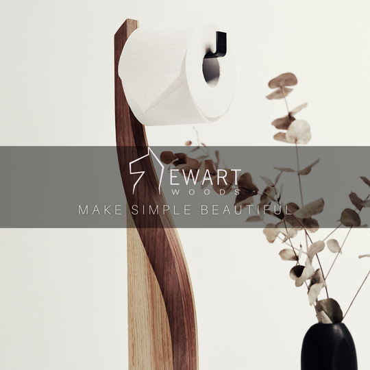 Wooden standing toilet paper holder in ashwood with walnut color detail and metal holder made by EWART WOODS