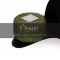 Floating black metal shelf with a curved design, holding a ribbed green container. The Ewart Woods logo and the slogan "Make Simple Beautiful" are overlaid across the center.