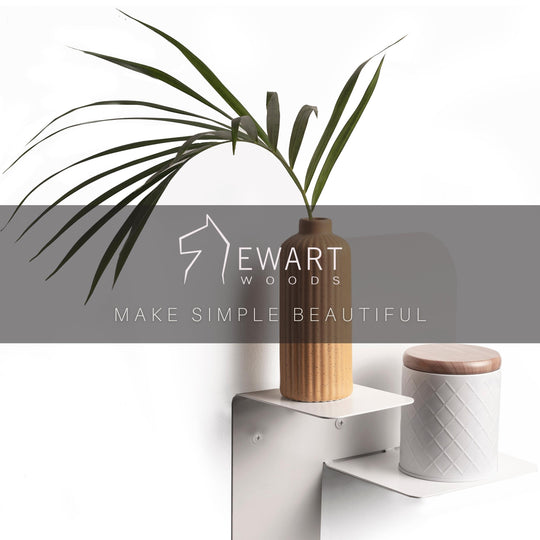 Elegant wall-mounted fixture in a crisp white finish, ideal for a minimalist interior. The fixture includes two tiers, offering a refined platform for showcasing decorative pieces while keeping a clean, understated design.