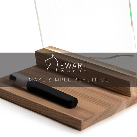 Close-up of a wooden base with an acrylic panel, featuring the &