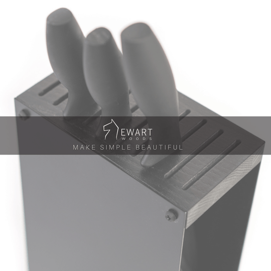 Black knife block with three black-handled knives, featuring the Ewart Woods logo and the slogan &