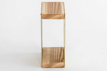 Side view of a gold-colored rectangular container with a slotted wooden top and base, showcasing the natural wood grain texture.