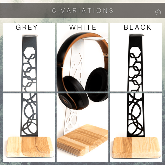 This image showcases three variations of the headphone stand, available in grey, white, and black, each featuring a different design cutout on the steel frame and a natural wood base.